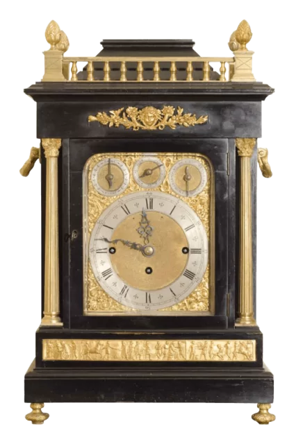 Antique bracket clock in ebonised case with brass composite dial.