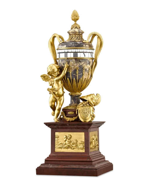 An annular clock in a urn shaped case, circa 1880