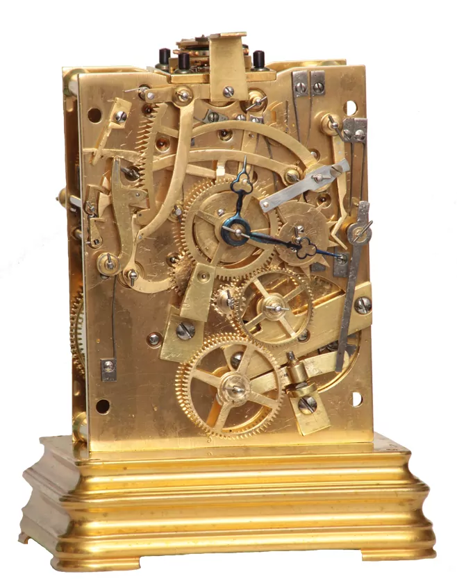Carriage clock movement with dial removed, showing rack striking work.