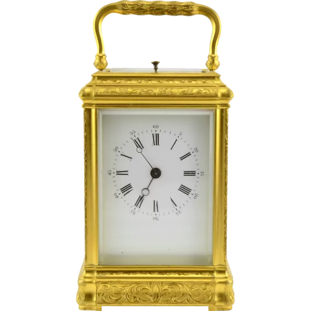 Carriage clock in engraved gilt gorge case with grande sonnerie striking circa 1870.