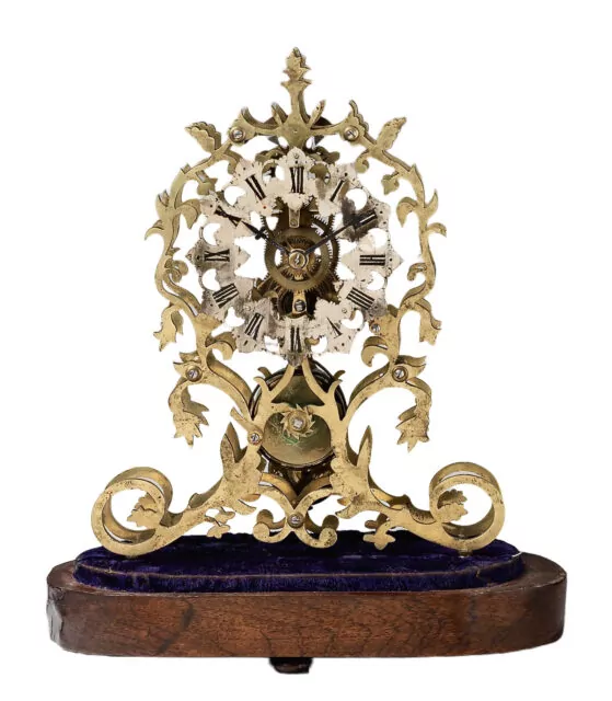 Victorian skeleton clock with glass dome removed, circa 1860.