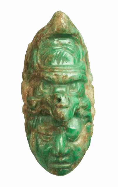 Title: Pendant Artist: Maya artist(s) Date: 600–700 CE Geography: Southern Mexico, Guatemala, Honduras, or Belize Culture: Maya Medium: Jadeite, pigment Dimensions: H. 3 × W. 1 1/2 × D. 1 1/2 in. (7.6 × 3.8 × 3.8 cm) Classifications: Stone-Ornaments, Jade