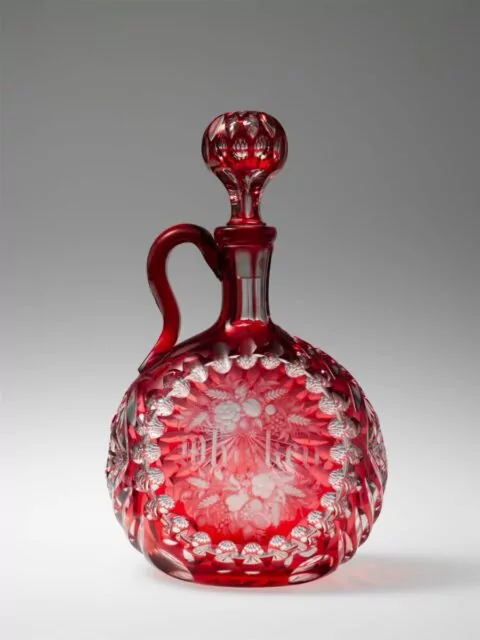 Title: DecanterDecorator: George Franklin Lapham (1836–80s)Manufacturer: Boston & Sandwich Glass Company (American, 1825–1888, Sandwich, Massachusetts)Date: 1867Geography: Made in Sandwich, Massachusetts, United StatesCulture: AmericanMedium: Blown, cut, and engraved glass