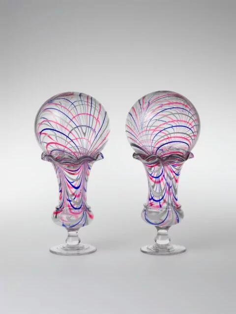 Title: Vase with witch ballMaker: Probably New England Glass Company (American, East Cambridge, Massachusetts, 1818–1888)Date: 1850–75Geography: Made in East Cambridge, Massachusetts, United StatesCulture: AmericanMedium: Blown glassDimensions: H. 13 1/2 in. (34.3 cm); Diam. 6 1/2 in. (16.5 cm)
