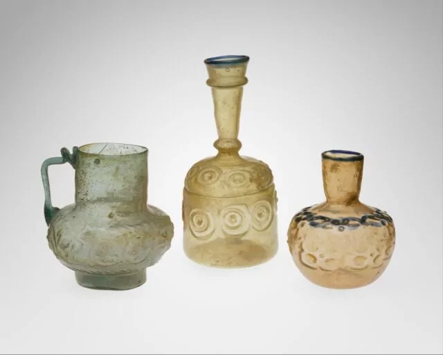 Title: Ewer with Floral ScrollDate: 12th centuryGeography: Attributed to IranMedium: Glass, green; mold blown, applied handleDimensions: H. 5 3/4 in. (14.6 cm)Classification: Glass