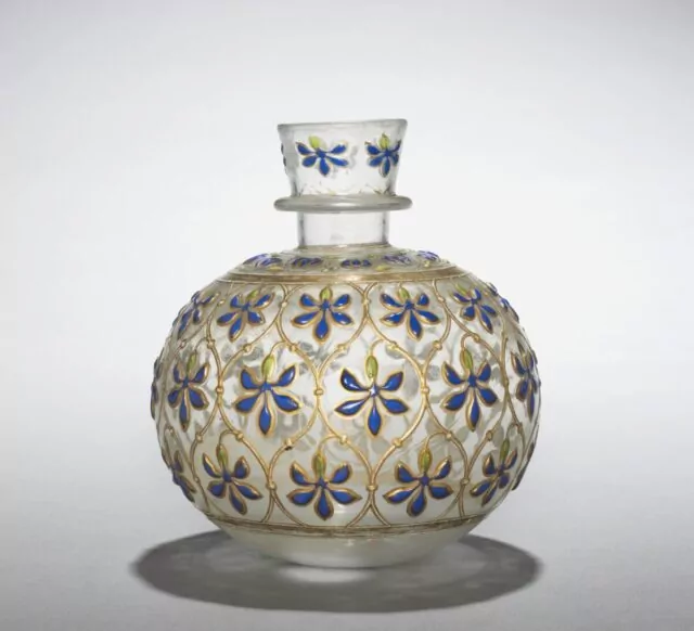 Glass Hookah Base with Enamel & Gilding, India, Mughal Dynasty(1526-1756), Early 18th Century. Smoking tobacco was introduced to the Mughal court from Iran in the very early 1600s and soon became popular. This base formed part of a hookah, or water pipe, which consisted of a base that held water—sometimes perfumed with herbs or fresh fruit—a detachable bowl to hold tobacco, and a long tube. Early hookahs used existing vessels for bases, including coconut shells. By the late 1600s or early 1700s, richly decorated pieces like this were produced. The jewel-like decoration of blue and green blossoms evokes a garden in which a smoker might have sat.