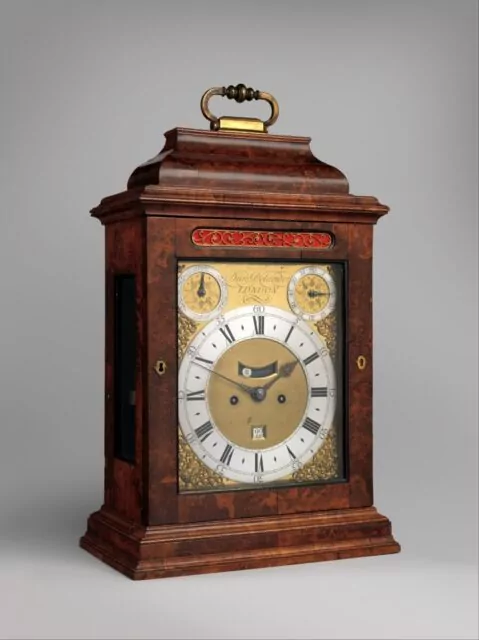 Daniel Delander (British, c. 1678-1733), Table Clock with Calendar, Circa 1720.Case: walnut, oak veneered with walnut and burl walnut; stained wooden moldings; and brass fittings; Dial: gilded and silvered brass; Movement: brass and steel